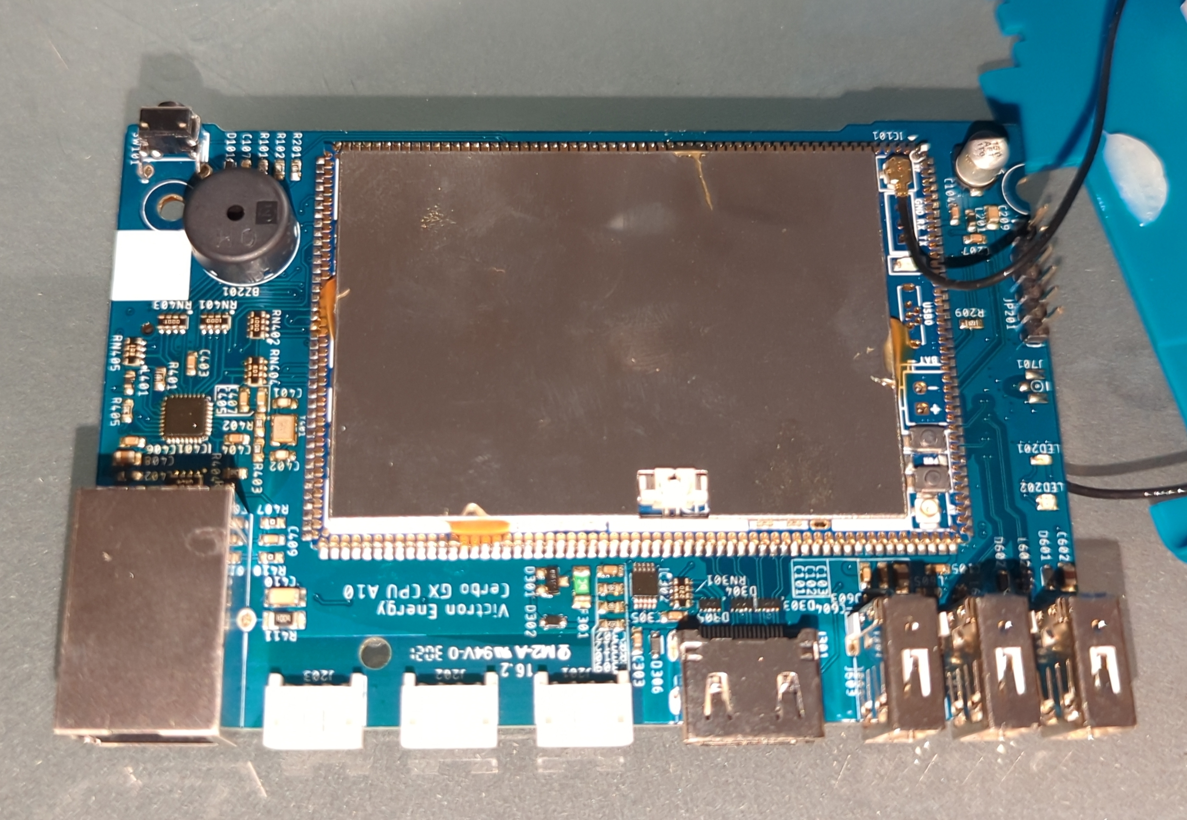 The mainboard from the front but still attached to the antenna.